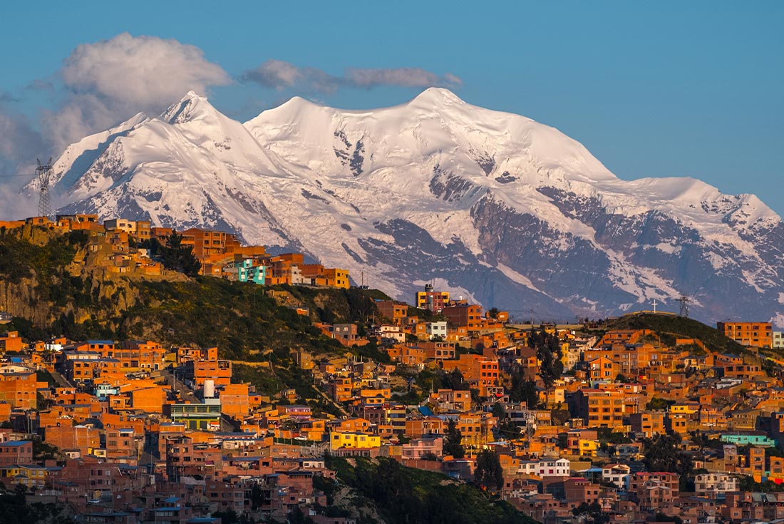The city of La Paz in Bolivia surrounded by snow capped mountains