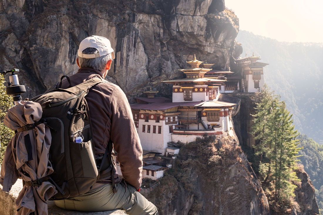 Traveller overlooking Tiger's Nest Temple, Part, Bhutan