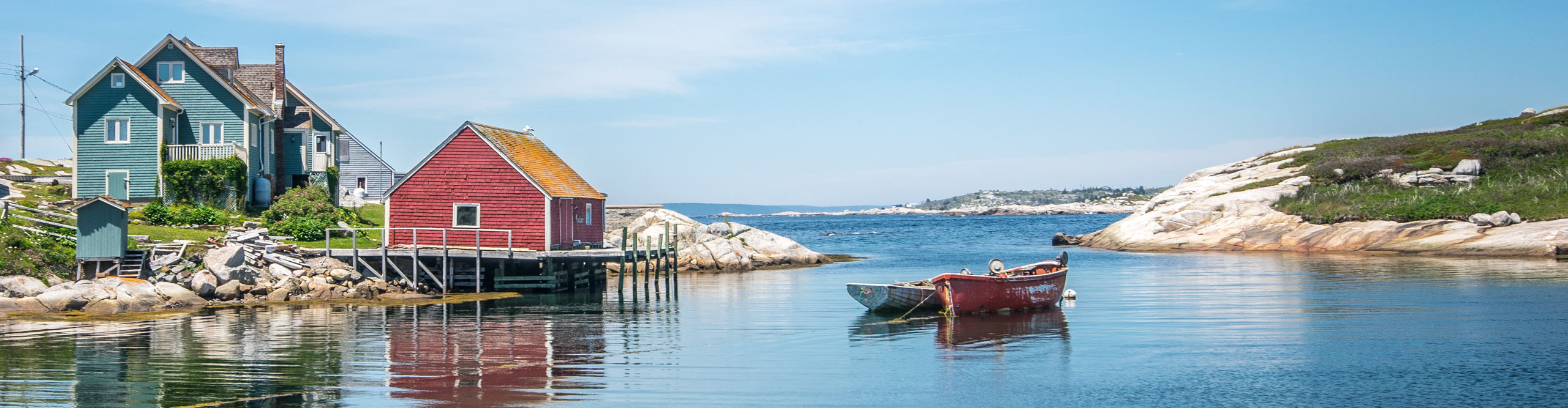 Boats in a harbour of Peggy's Cove, Nova Scotia, on a clear sunny day