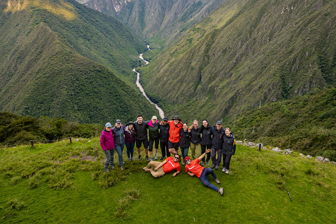 Intrepid travellers and leaders pose for a group shot at Intipata Archaeological Site on the Inca Trail in peru