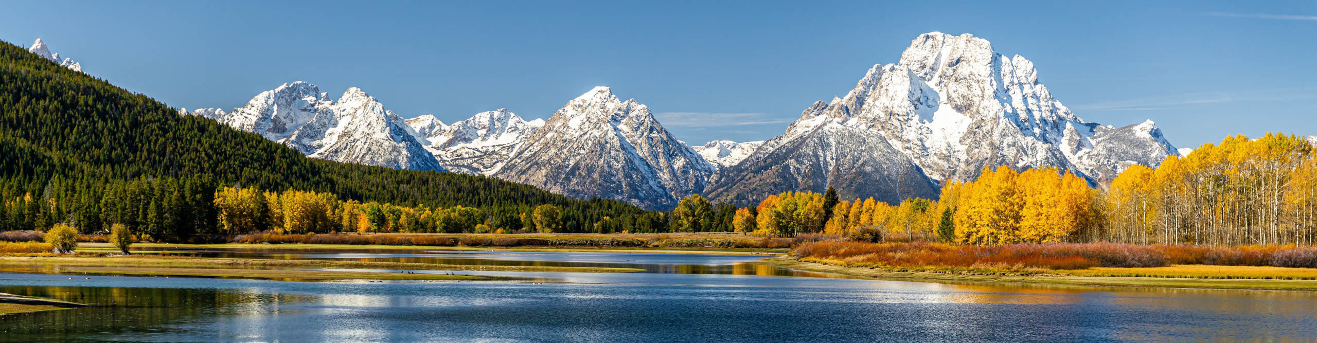 view of Mount Moran from Oxbow Bend beside Snake River of Grand Teton, Wyoming, USA