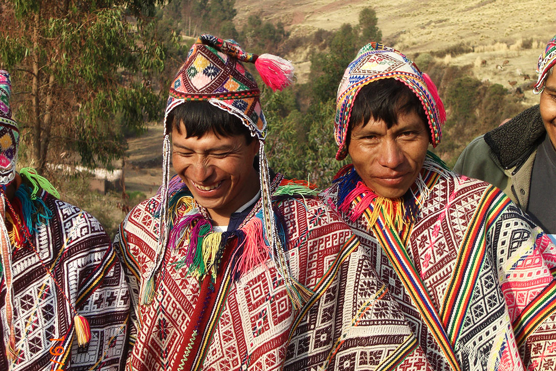 Two local men in traditional Peruvian dress and ponchos, Peru