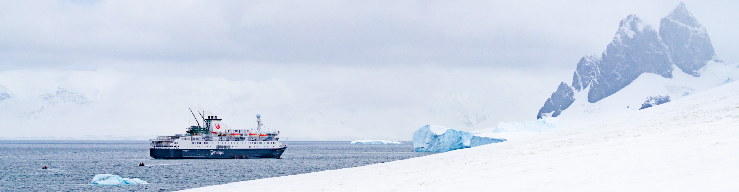 Cruise boat in the  water near Elephant Island, in the Antarctic circle, on an overcast day 
