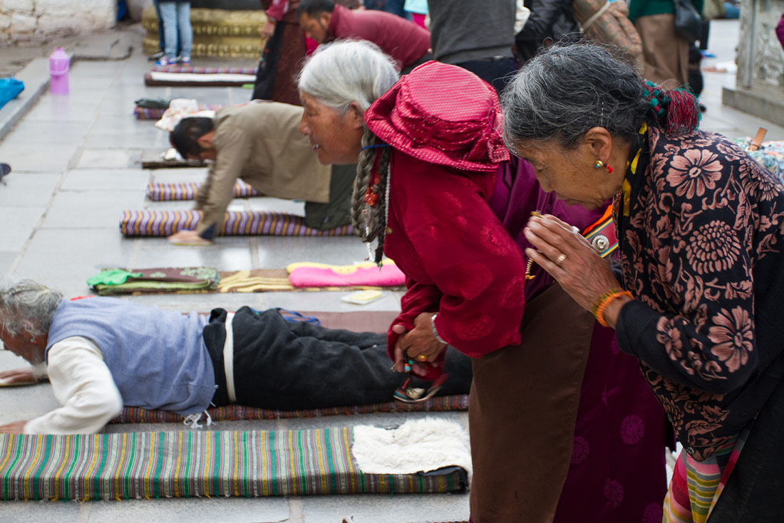 Local Tibetans praying at a temple in Lhasa