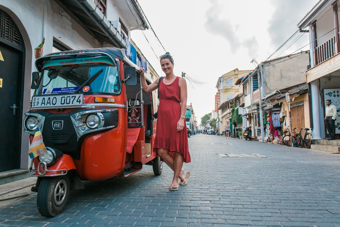 Traveller standing next to a tuk-tuk in Unawatuna, Sri Lanka on an Intrepid Travel tour