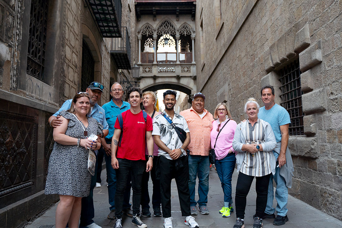 Group of Intrepid Travellers pose in the beautiful backstreets of Barcelona, Spain