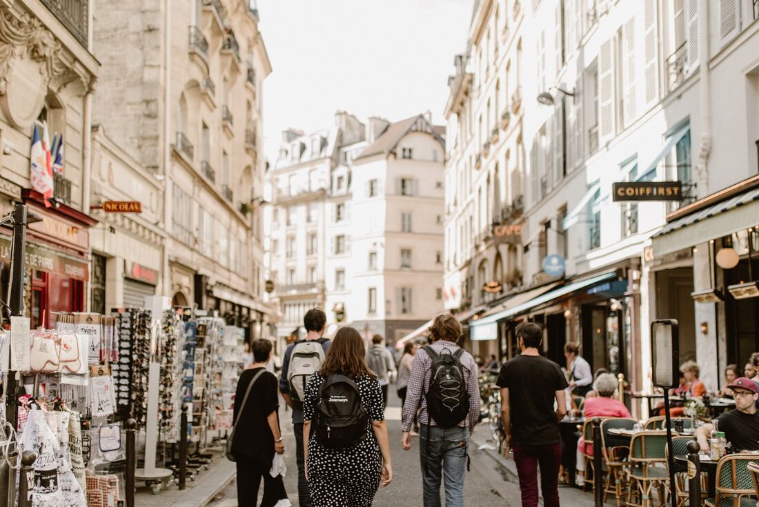 Travellers wander the back streets of Paris