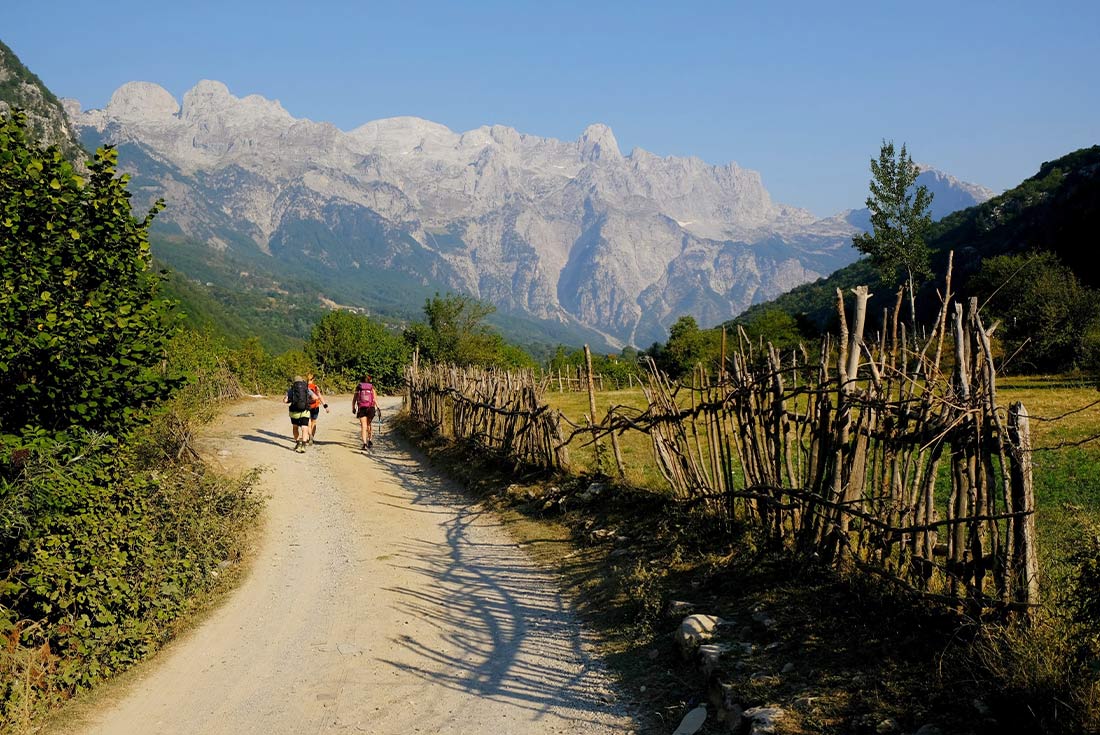 Group hiking through Theth, mountain village in the Albanian Alps, Albania
