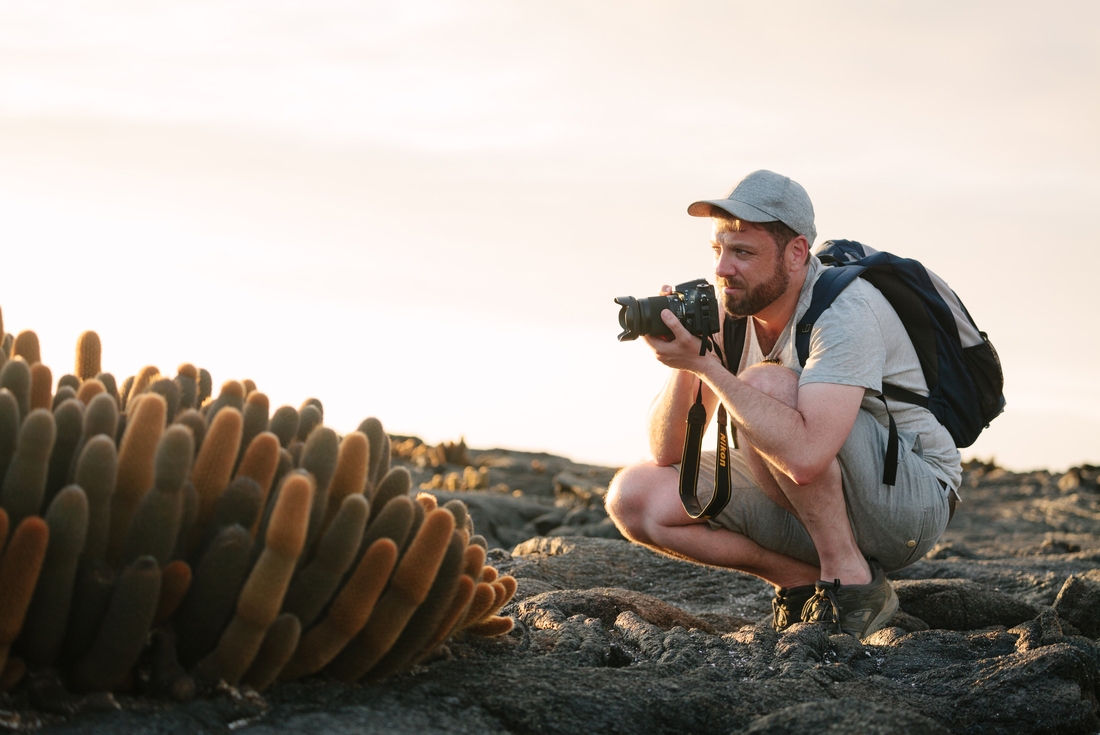 Traveller photographing flora on Galapagos Islands