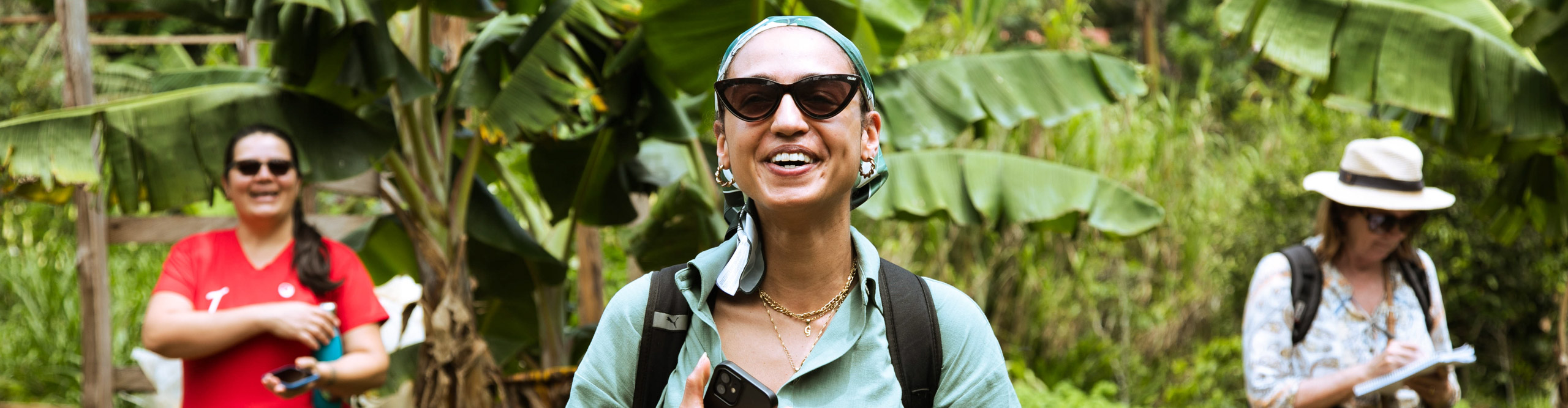 Travellers smiling at camera in the jungle in Costa Rica