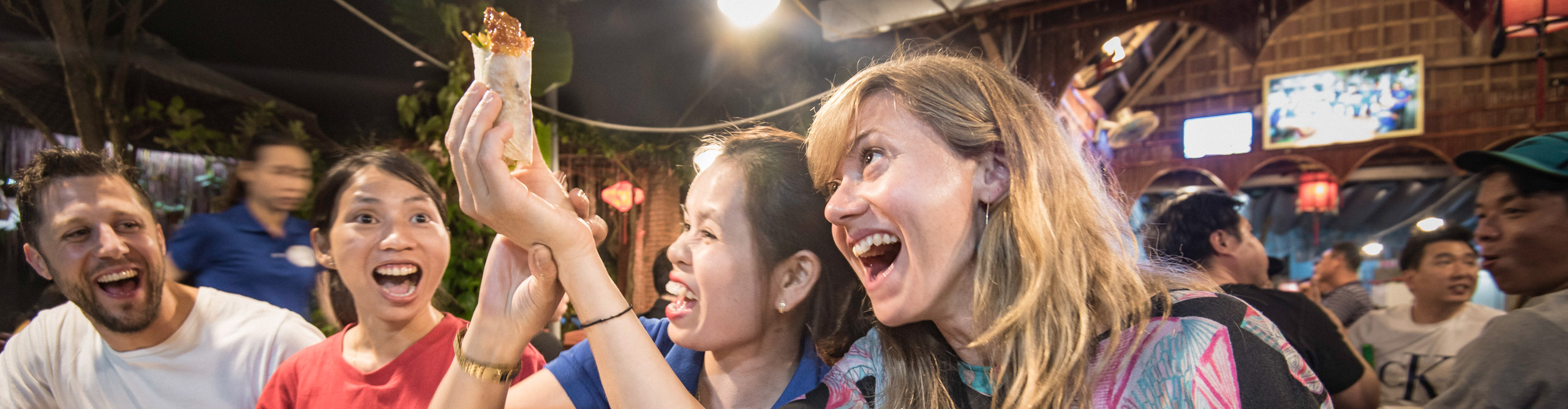 People drinking, having fun and smiling in Asia
