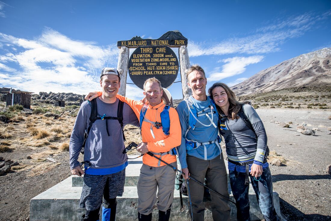Hikers reach third cave sign on the Mount Kilimanjaro hike