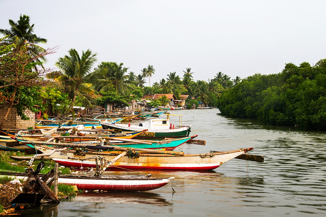 Moored boats along a waterway in Negombo, Sri Lanka