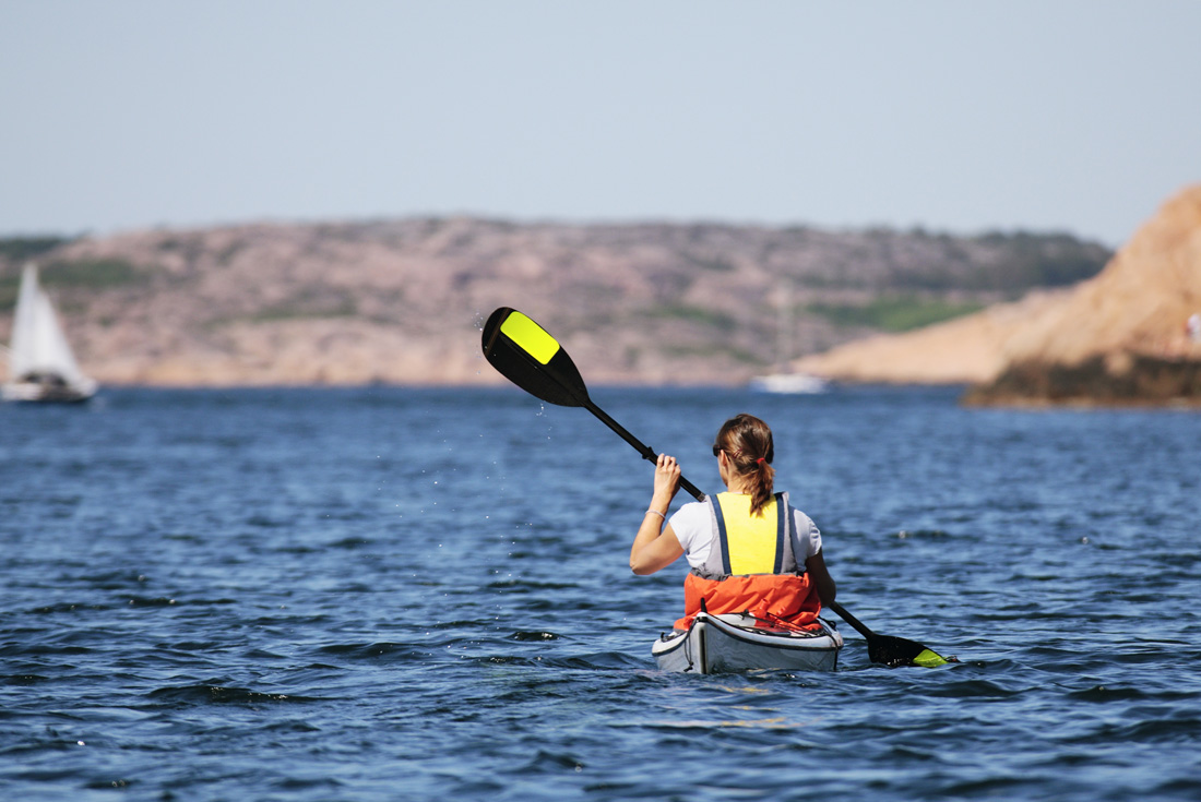 Intrepid Travel sweden vrango island woman kayaking