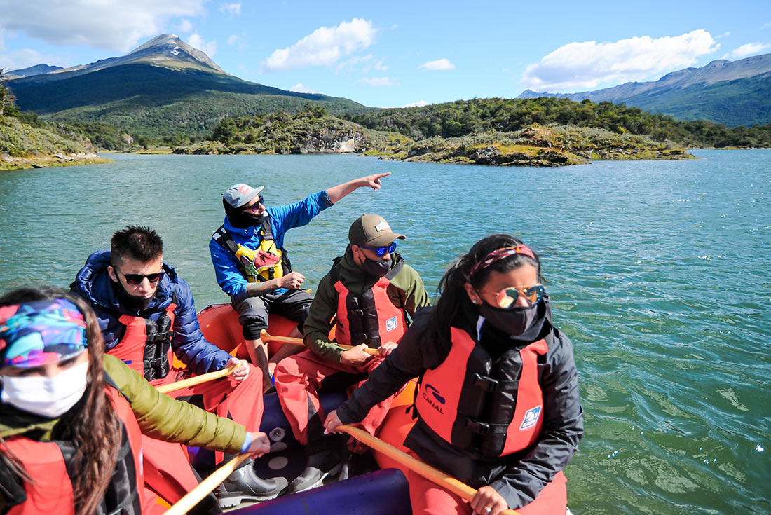 Group enjoying ride down the Lapataia River in inflatable boat, Tierra del Fuego, Argentina