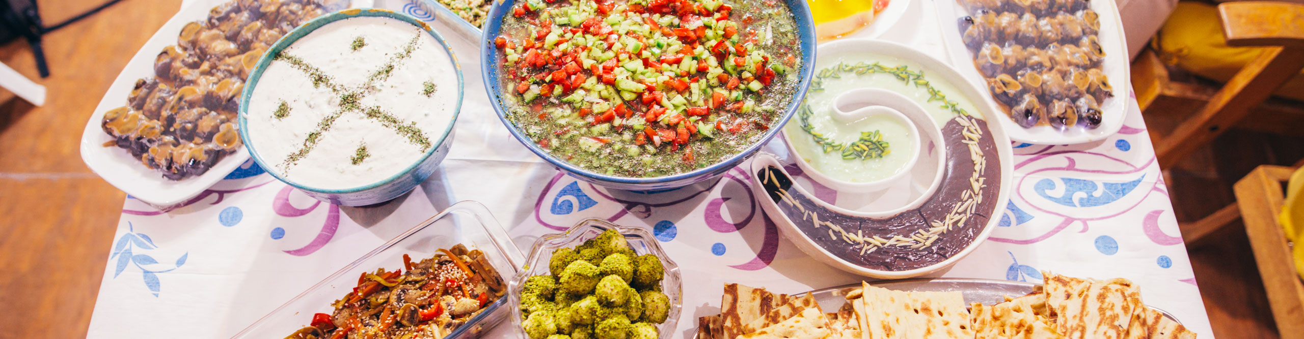 A table covered with various Middle Eastern dishes in Iran