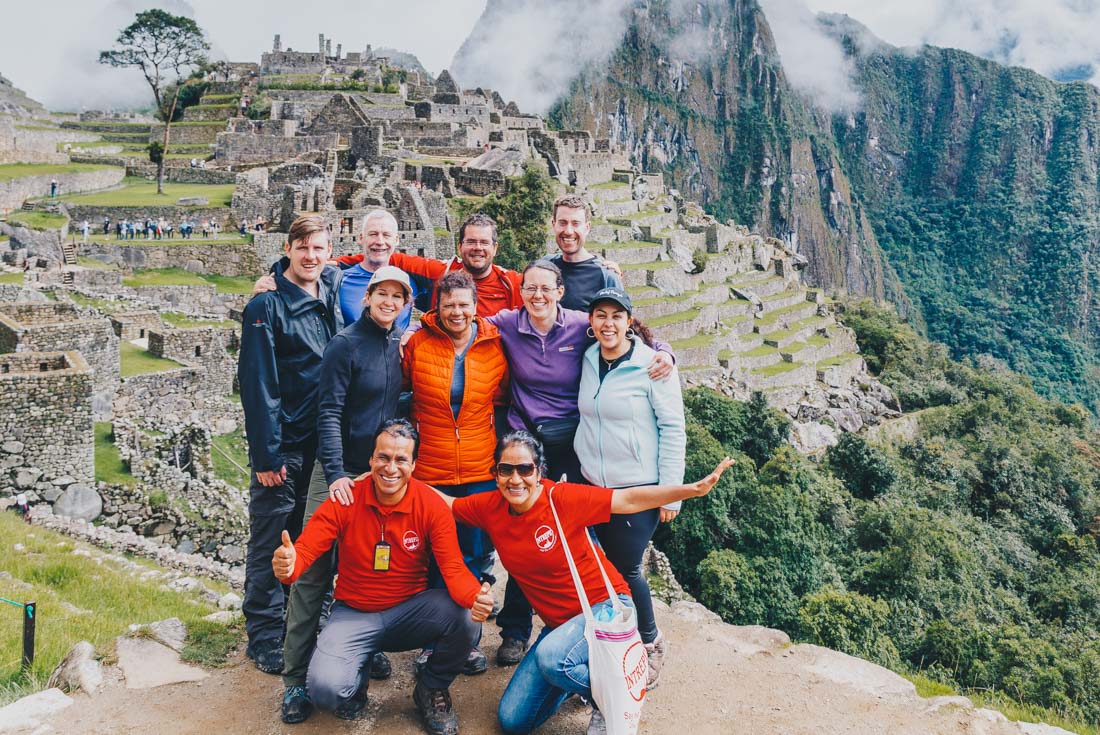 Group of Intrepid travellers at Machu Picchu on the Inca Trail in Peru
