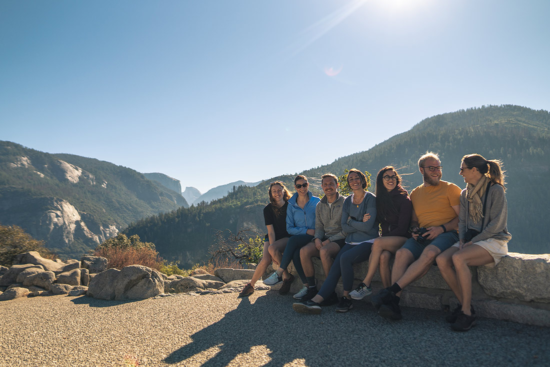 Group of travellers taking rest stop on hike in Yosemite NP