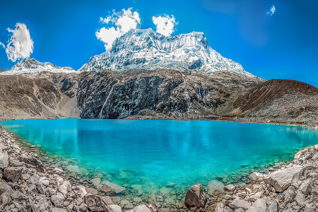 Beautiful blue lake and snow capped mountains Laguna 69 of Huascaran, Peru
