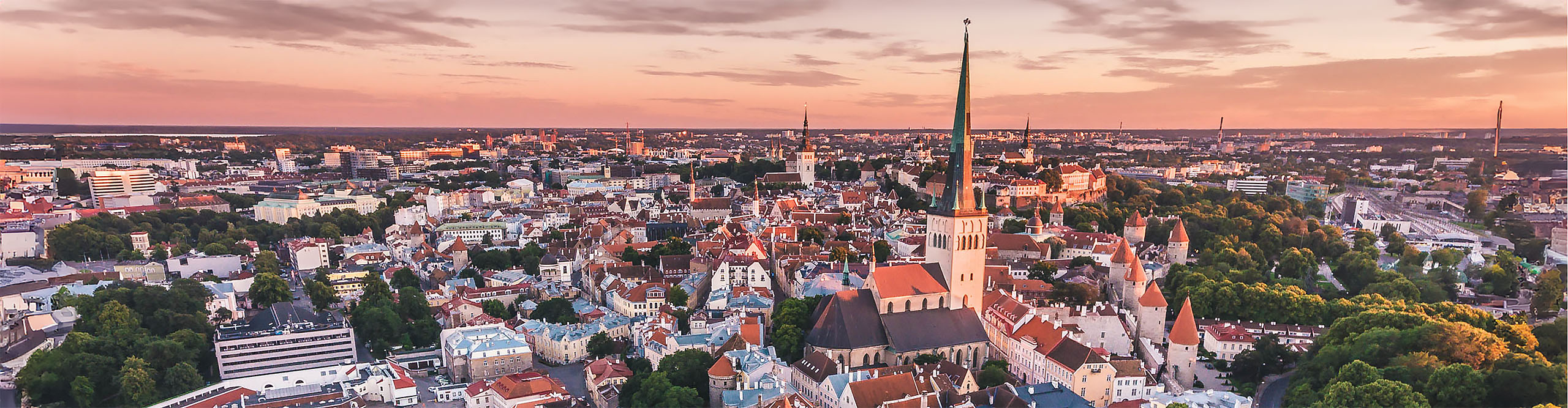 Aerial view of old town of Tallinn, Estonia, at sunset with a pink sky 