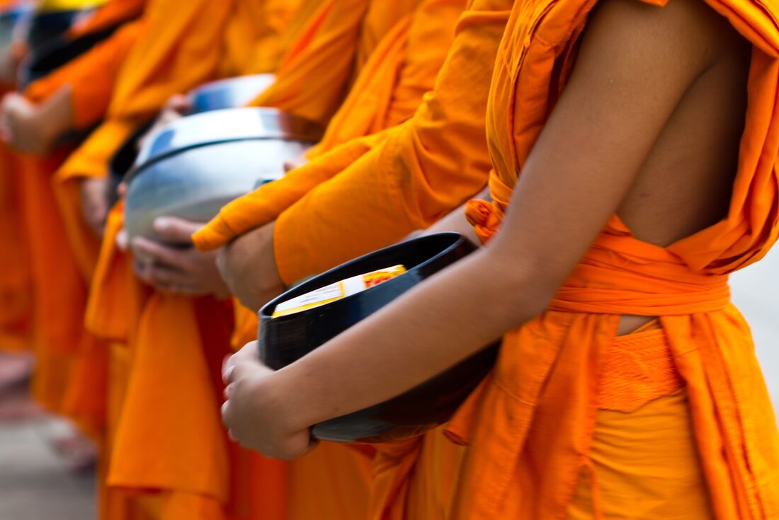 Cambodian monks with offerings bowl