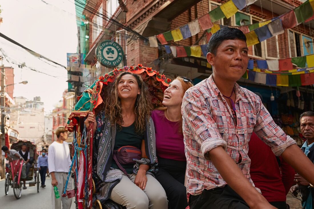 Travellers on a cycle-rickshaw in Kathmandu, Nepal