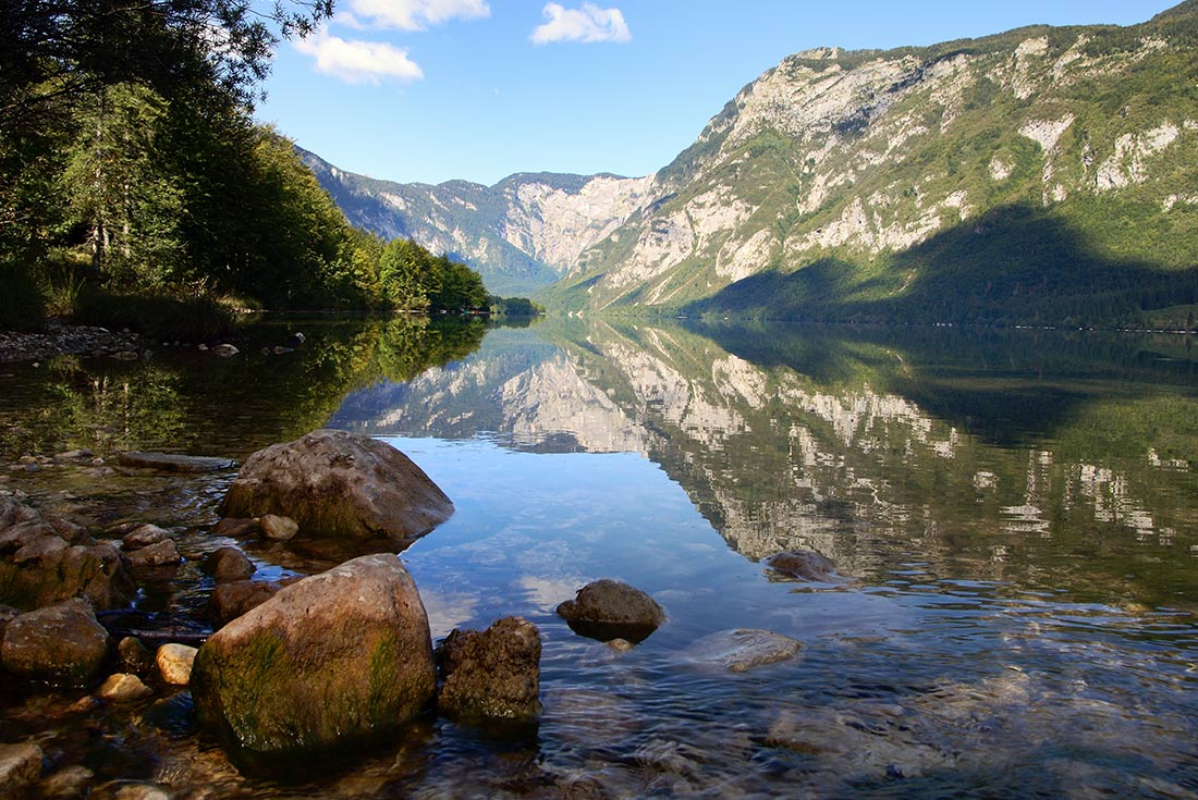 ZMPY - Scenic view of Lake Bohinj landscape with mountains in the background
