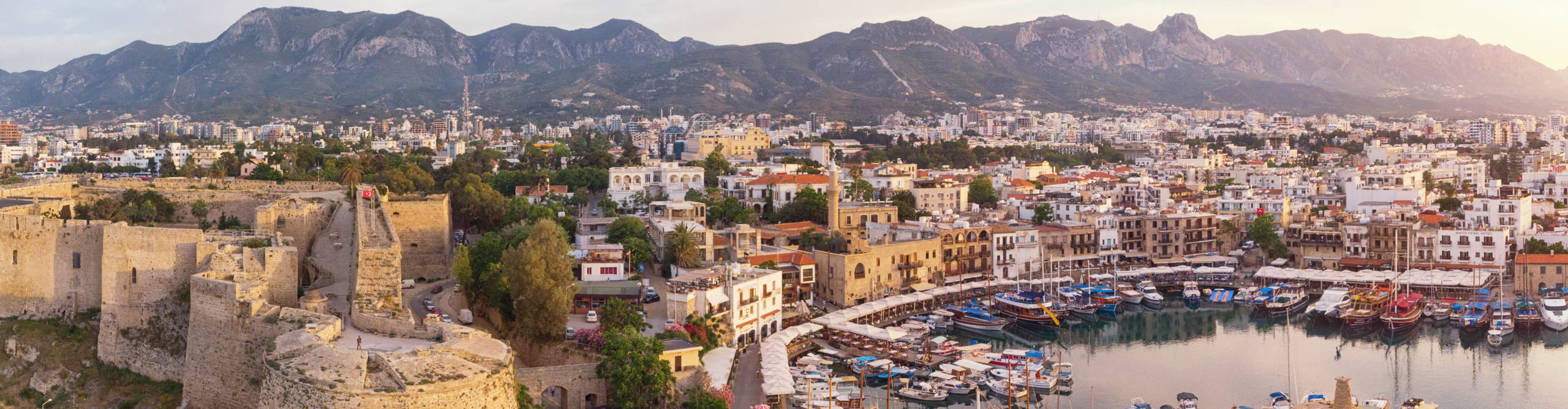Kyreniam, known for its cobblestoned old town and horseshoe-shaped harbor at dusk, northern Cyprus 