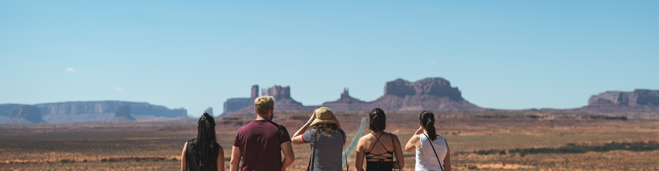 Intrepid travellers look out over Monument Valley