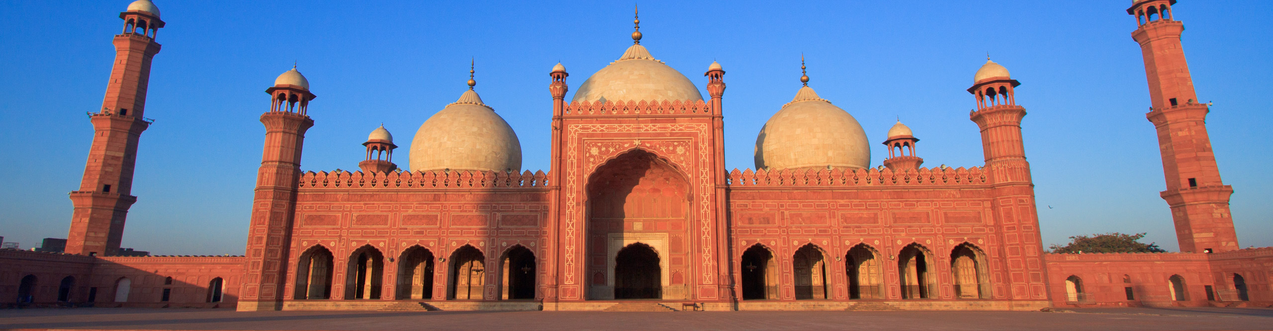The grand and beautiful Badshahi Mosque, in the glow of the late afternoon sun,  Lahore, Pakistan