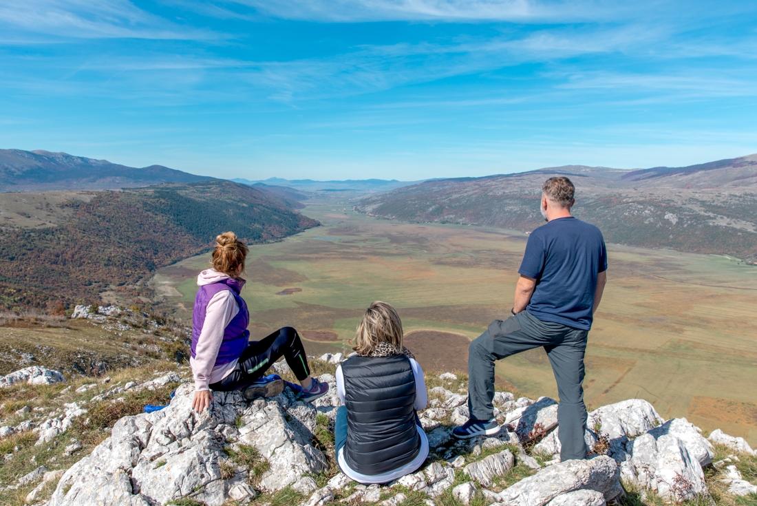 Intrepid travellers and leader look out over the valley at Livno, Boznia and Herzegovina