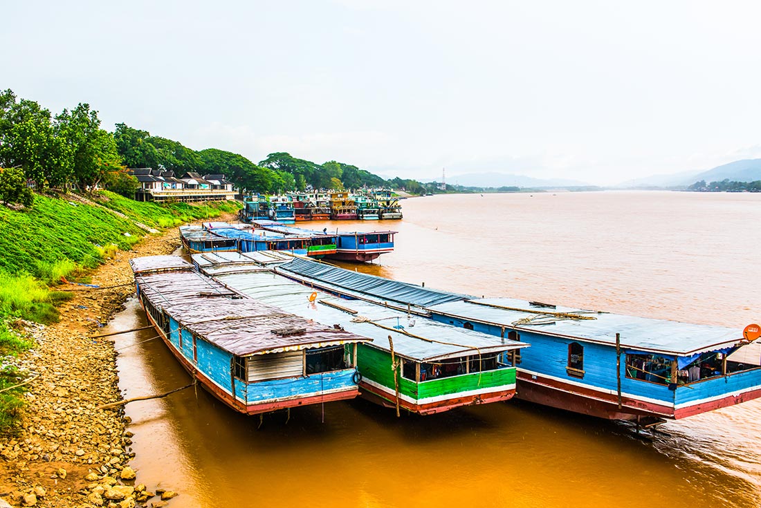 Landscape View of The Golden Triangle with long boats on the Mekong River, Thailand