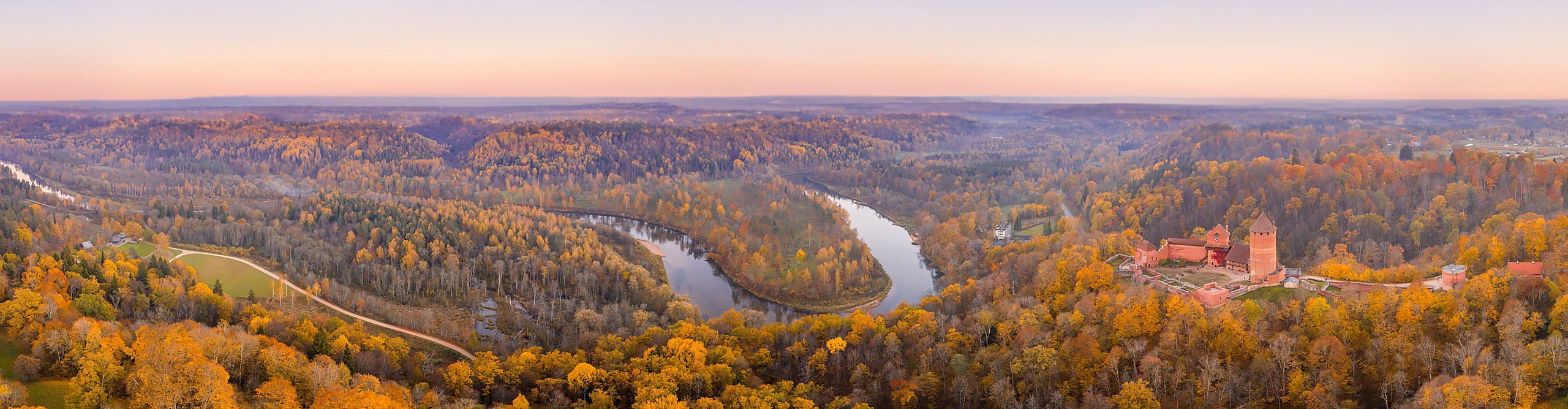 Amazing Aerial View over the Turaida Castle and Autumn Forest during Sunset, Sigulda, Latvia