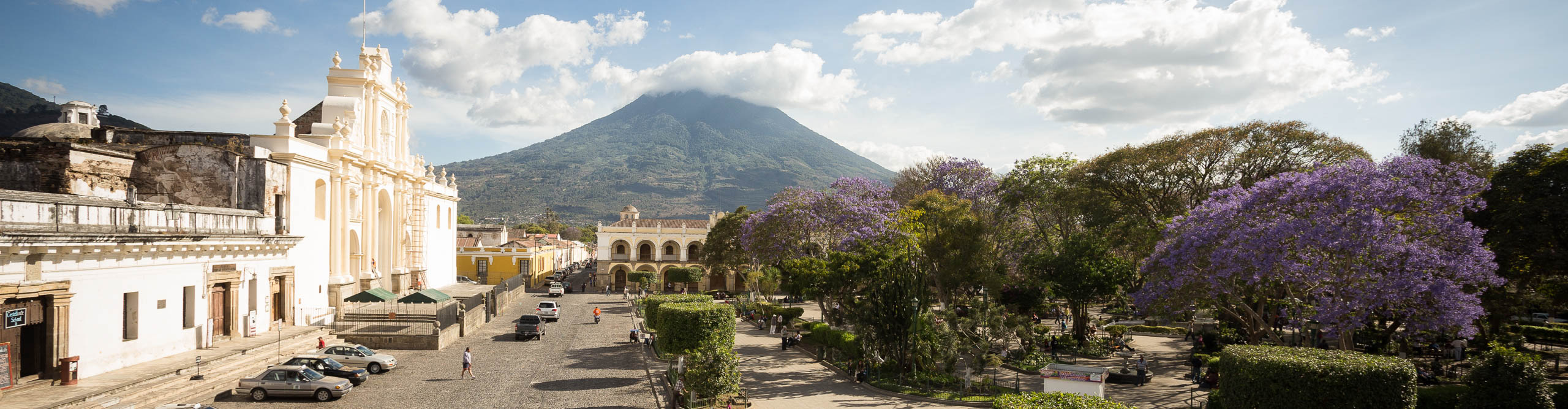Town square in Antigua with mountain in the distance on a sunny day in Guatemala 