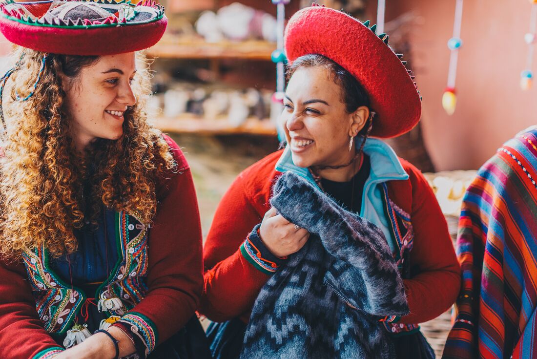 Travellers dress in traditional outfits in sacred valley, peru