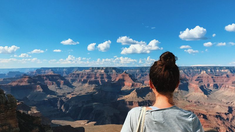 Girl looks out over the Grand Canyon