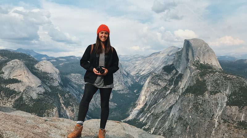 Girl stands in Yosemite National Park