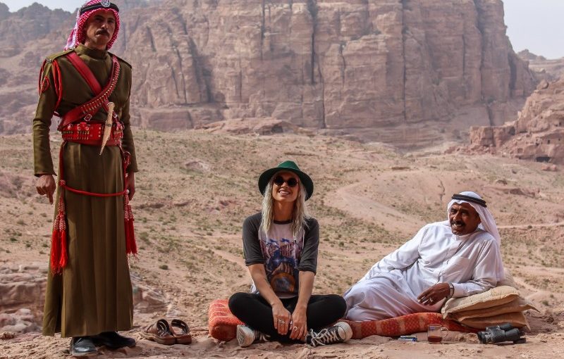 A traveller and two locals in Jordan