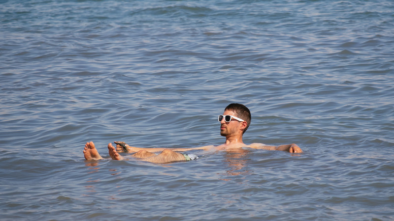 A man floats on the Dead Sea