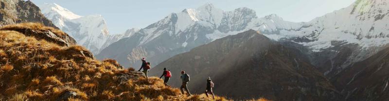 Hikers make their way up mountain range in Annapurna