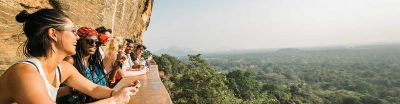 Group of travellers look out over Sigiriya lion rock fortress