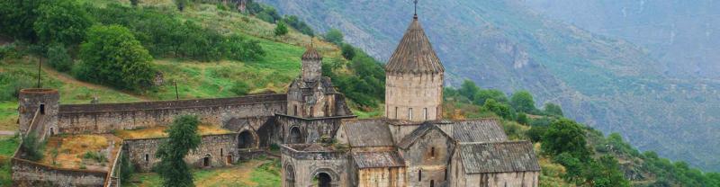 The medieval Tatev Monastery sits atop a green hill in Goris, Armenia
