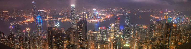 Panorama of Hong Kong at night with bright city lights