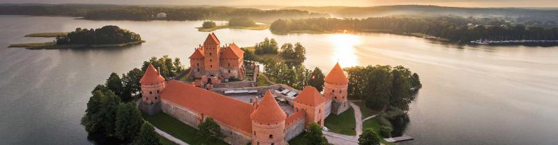 Sunset over medieval Trakai Castle, on an island in a lake in Lithuania