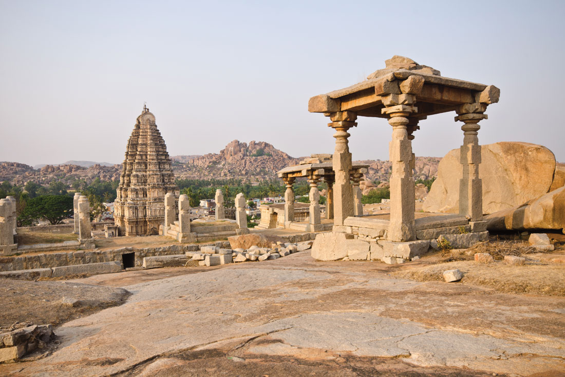 Virupakska Temple surrounded by rock formations in Hampi, India