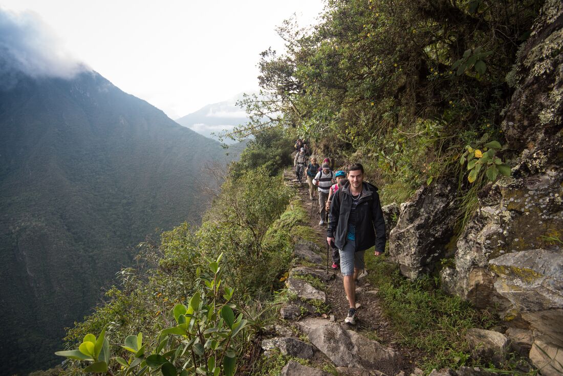 travellers hike machu picchu, Peru 