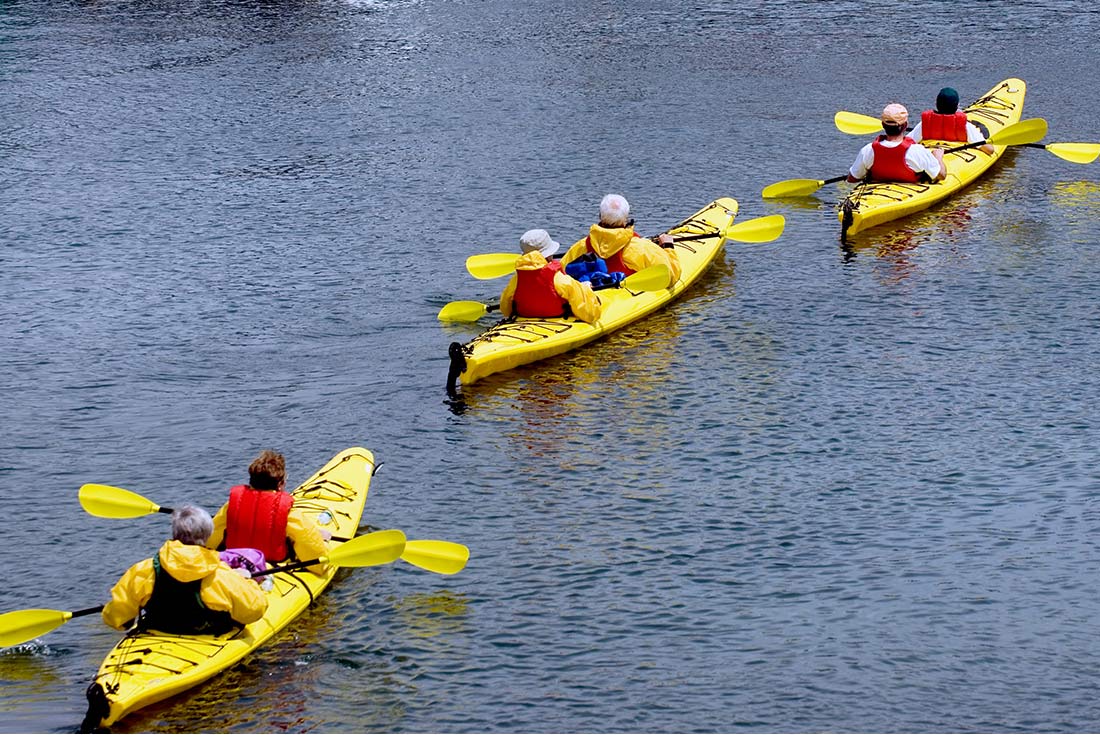 Travellers kayaking in Acadia National Park, Maine, U.S.A.