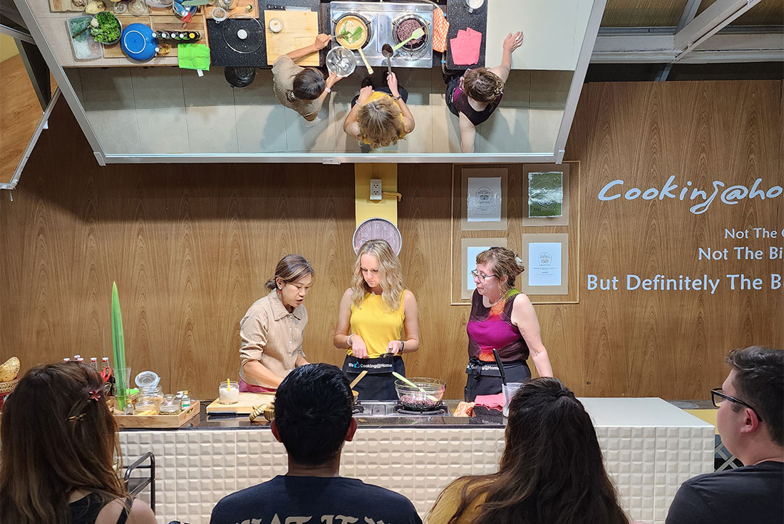 Several travellers enjoy a home style cooking class with Cooking At Home