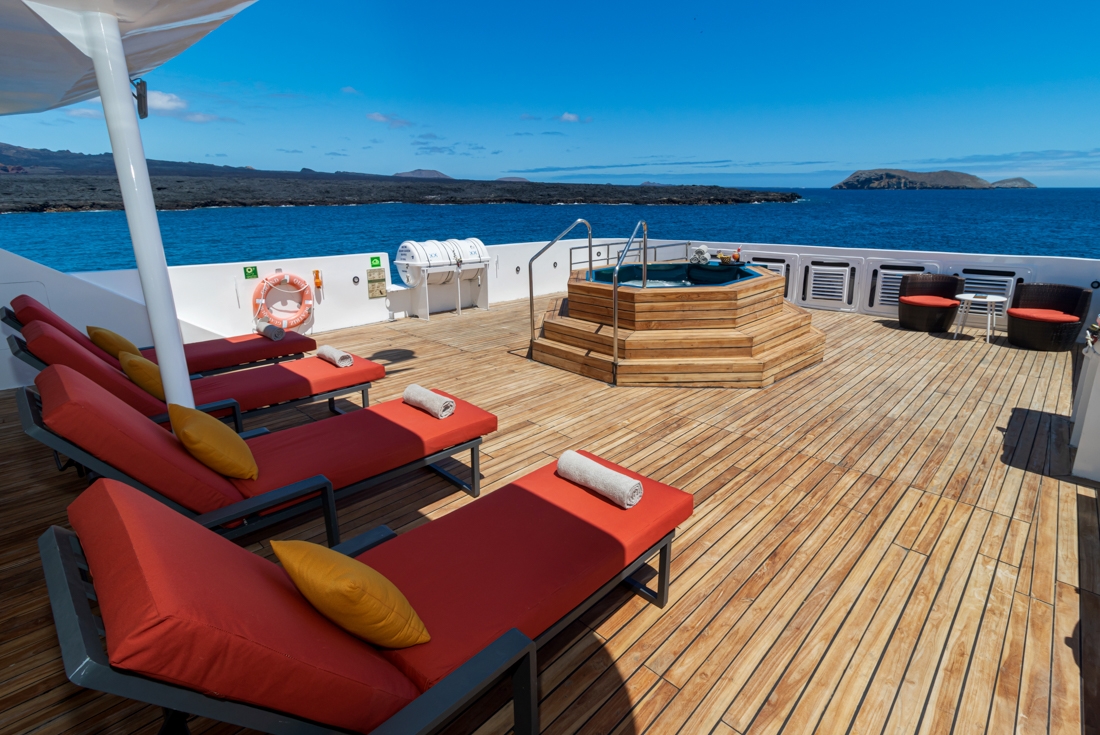 Back deck of the Grand Queen Beatriz with loungers and hot tub