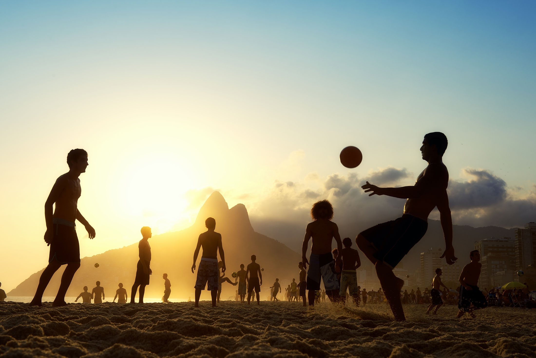 Playing football on Copacabana beach in Rio de Janeiro